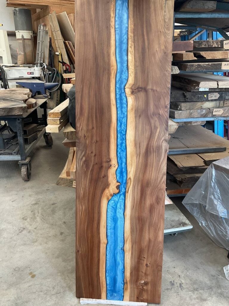 Custom elm console table with blue epoxy river built in Yelm WA